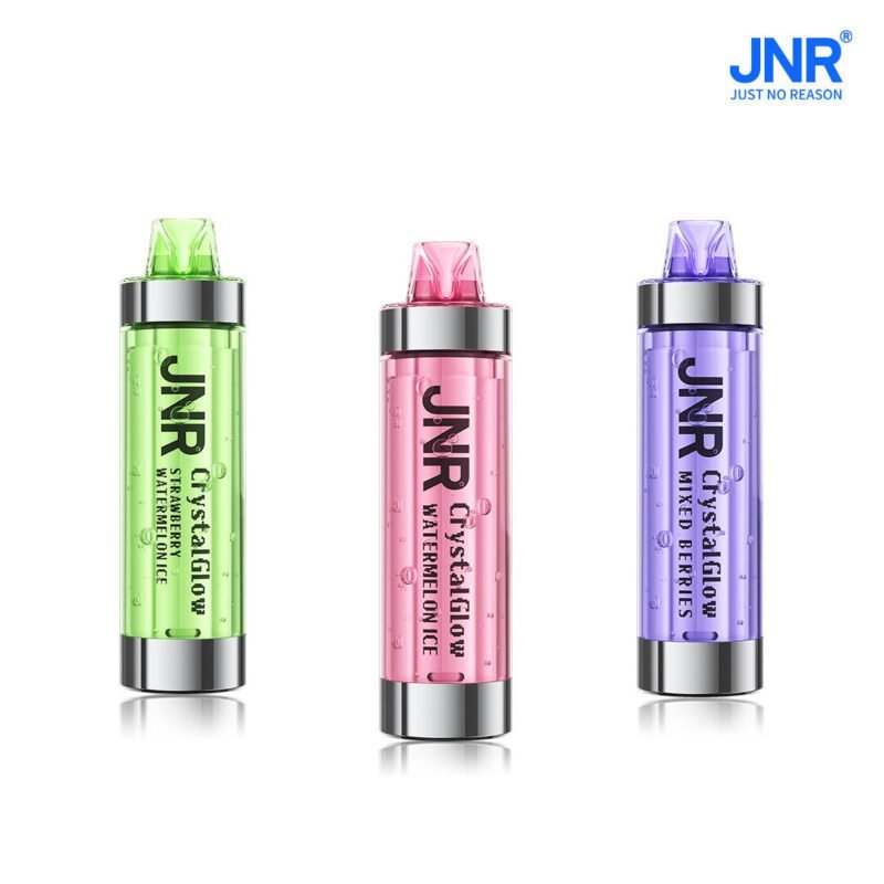 Three JNR Crystal Glow disposable vape devices in green, pink, and purple colors representing Strawberry Watermelon Ice, Watermelon Ice, and Mixed Berries flavors