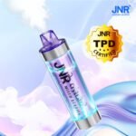 JNR Crystal Glow Mixed Berries disposable vape in purple color emitting vapor with TPD certification badge displayed on a light background